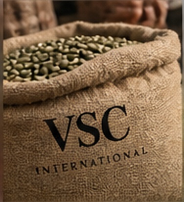 Green coffee beans drying near a mountain origin